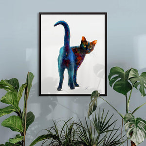 Framed Black cat canvas displayed in a contemporary interior, showcasing a cheeky black cat looking back at us over his shoulder.