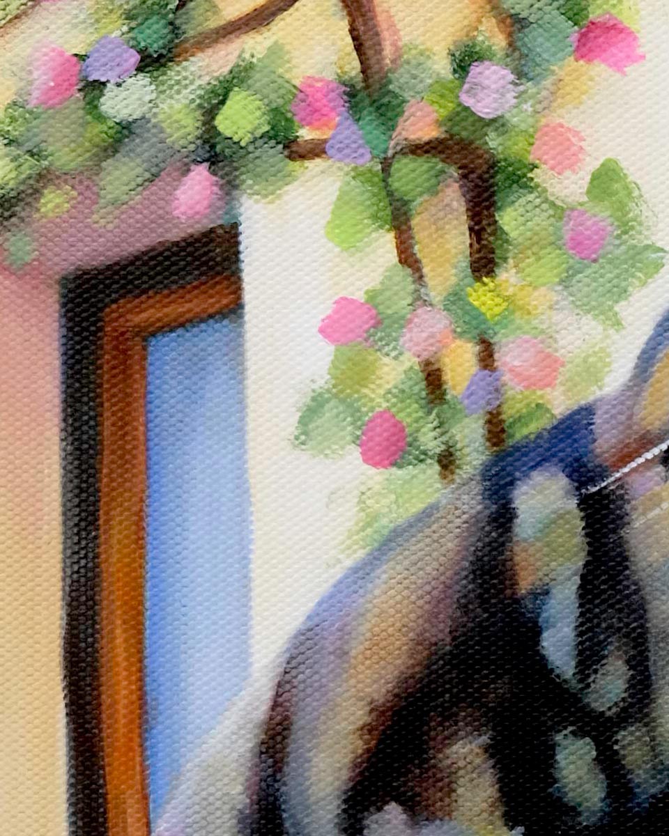 close up of a painting of a tabby cat in front of a wall of roses. Shows the texture of the paint and canvas