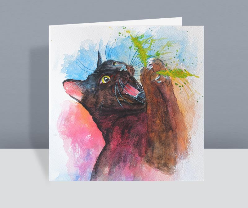 a black cat card. This cute black cat is catching a feather toy. He has big eyes and an excited expression. Created from an original watercolour.