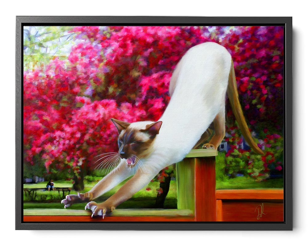 A framed canvas print of a siamese cat stretching surrounded by pink flowers