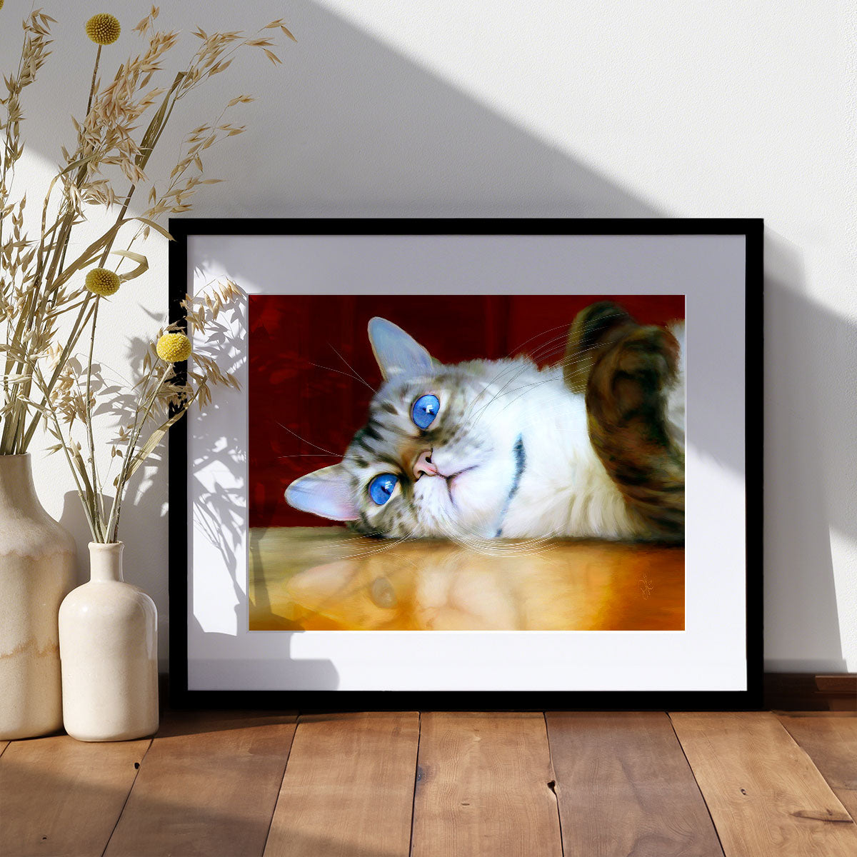 fine art print of a snow bengal cat with blue eyes lying on a table