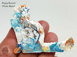pretty fluffy cat brooch in blues and whites with a touch of orange. She is a one of a kind pin.