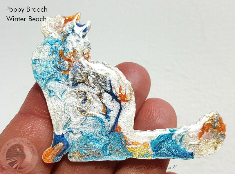 pretty fluffy cat brooch in blues and whites with a touch of orange. She is a one of a kind pin.
