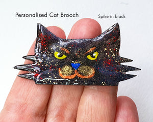 Custom cat brooch representing Spike, a black cat with a fierce expression, uniquely designed for cat fans.