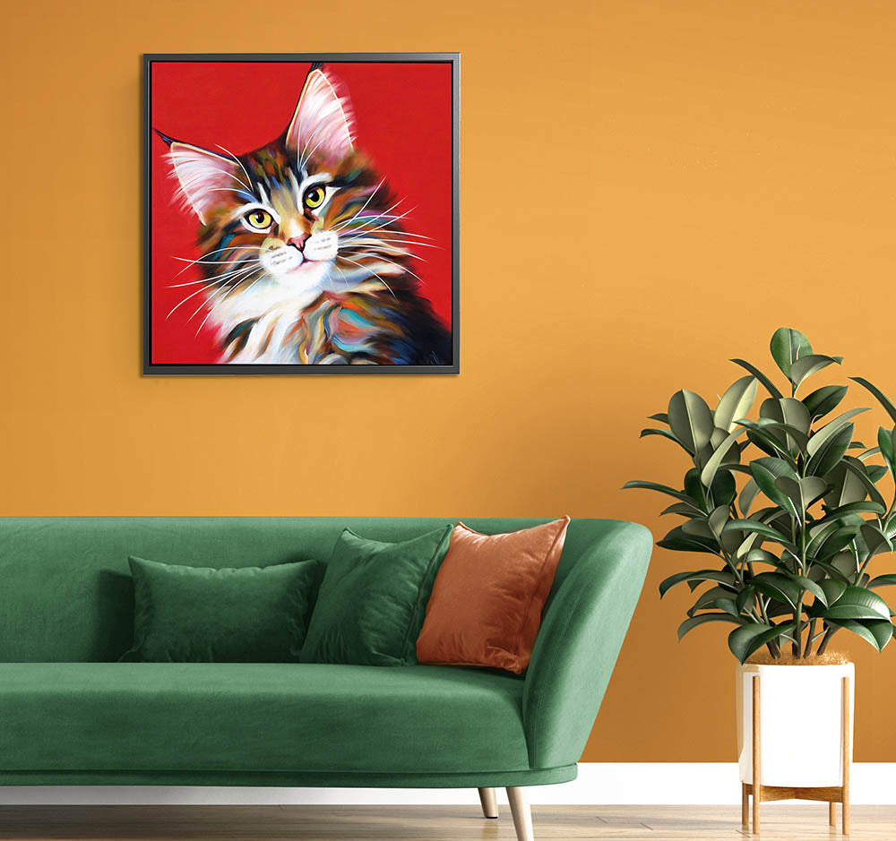 Stylish interior scene showcasing a framed Maine Coon cat canvas above a green sofa, adding charm to home decor.