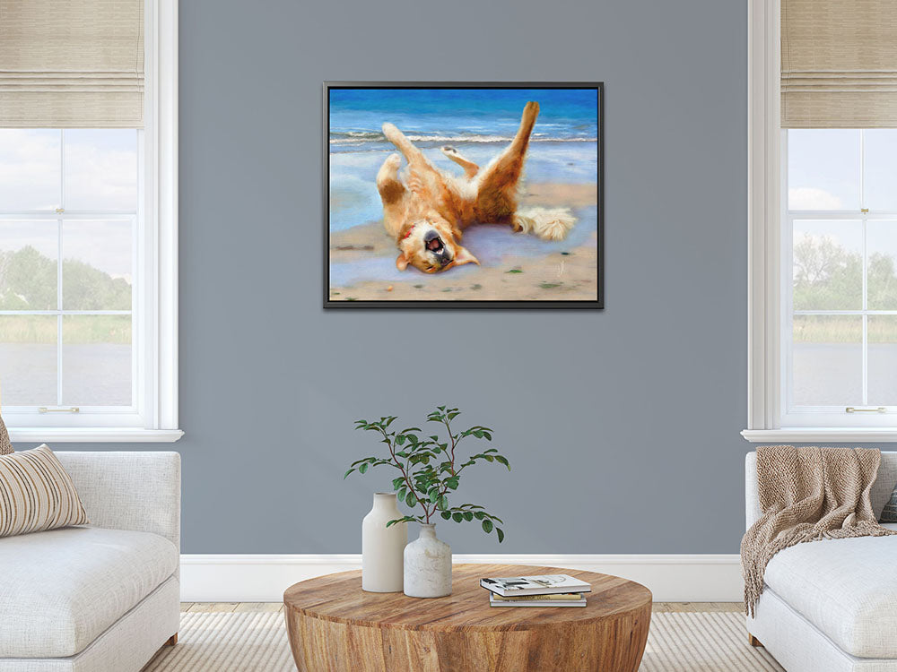 Golden Retriever home decor.  Max is enjoying a sunny day at the beach. The framed canvas hangs in a living room in a modern apartment.