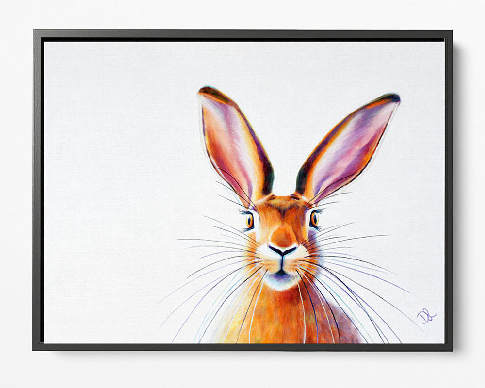 Peek A Boo! - Framed Canvas Hare Print, presented elegantly in a classic black frame. By Denise Laurent.