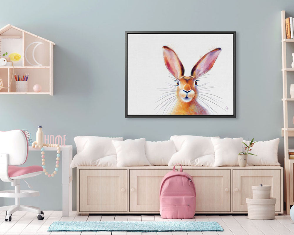 A Framed Canvas Print featuring a whimsical hare with big ears and whiskers, in a child's  room, adding a cheerful touch to the decor. Art for kids.