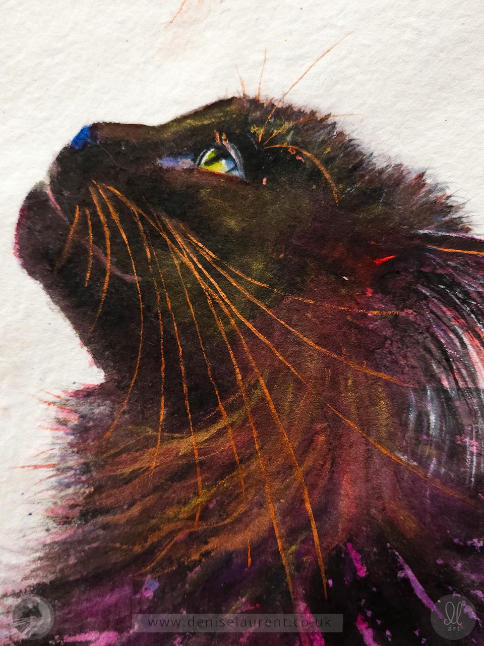 A watercolor painting of a black cat looking upwards, rendered with vibrant purple, pink, blue, and copper brushstrokes on textured white handmade paper. The artwork is shown flat on an easel.
