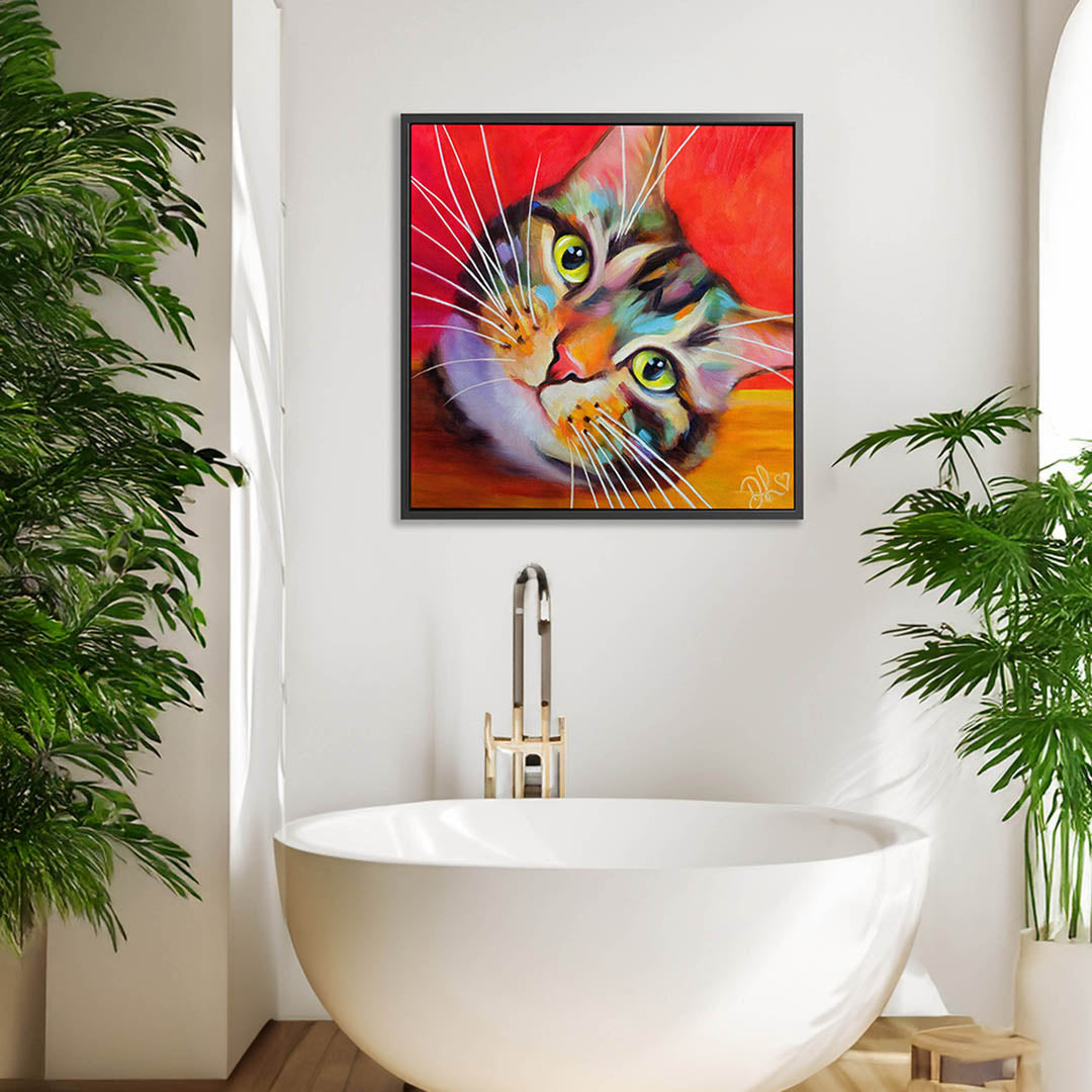 Colourful framed tabby cat canvas print featuring a close-up of a colourful tabby cat's face with big eyes and prominent whiskers, set against a bright red background.