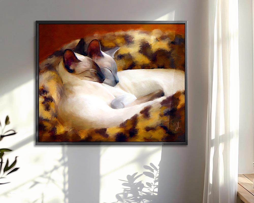 Sleeping Siamese - siamese cat wall art featuring two Siamese cats snuggled together in their cat bed, ideal for adding warmth to any room with this Framed Canvas Print 