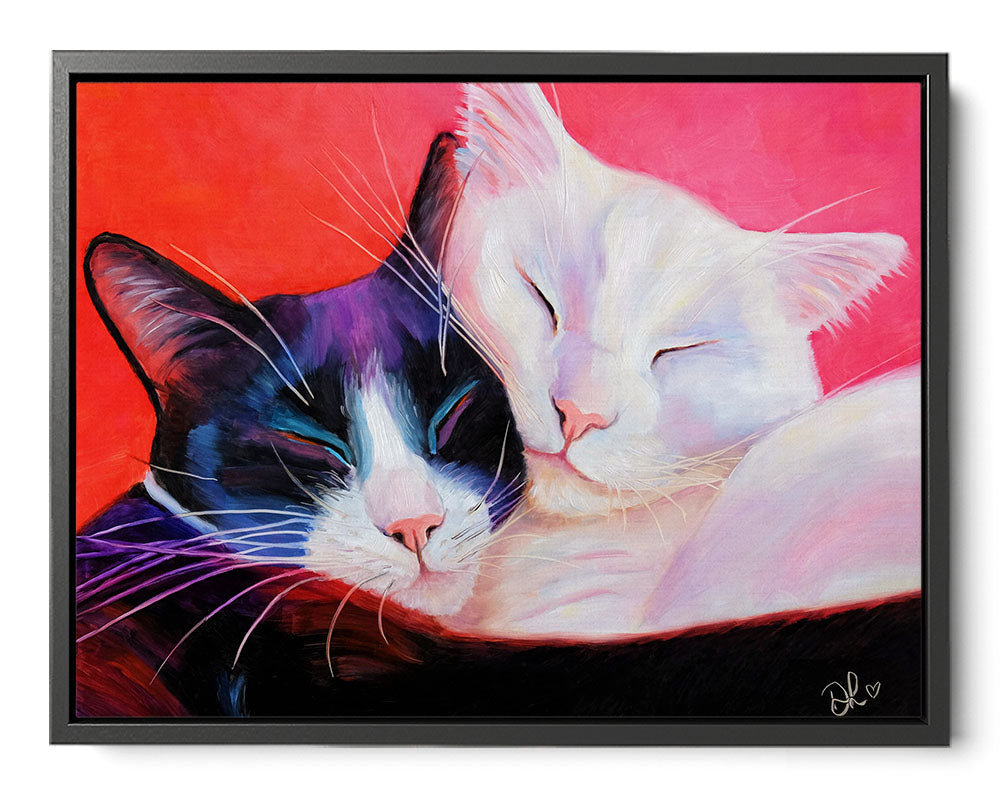 Framed artwork of two cats embracing on a red and pink background. framed canvas print