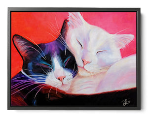 Framed artwork of two cats embracing on a red and pink background. framed canvas print