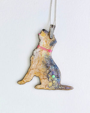 Border terrier dog-shaped necklace with a colorful design on a white background