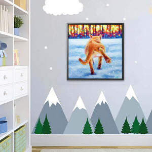 Framed artwork of a cat in the snow in a children's room