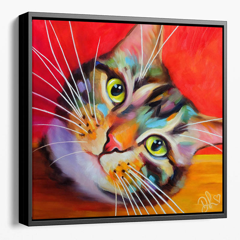Colourful framed tabby cat canvas print featuring a close-up of a colourful tabby cat's face with big eyes and prominent whiskers, set against a bright red background.