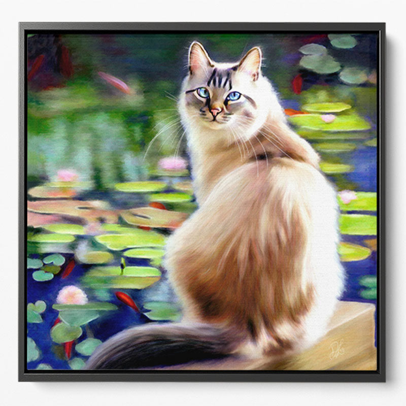 A colourful framed canvas print of a long haired cat sitting by a pond watching the fish swim by. He has lovely blue eyes.