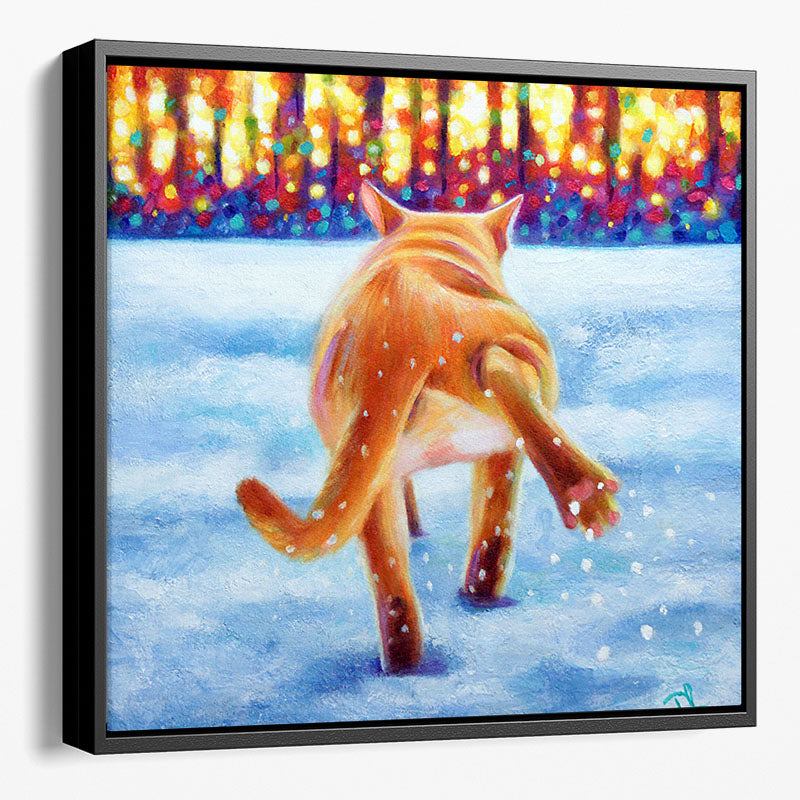 Ginger Cat Framed Canvas Wall Art. A Burmese cat cautiously walking through snow shaking his back paw. 